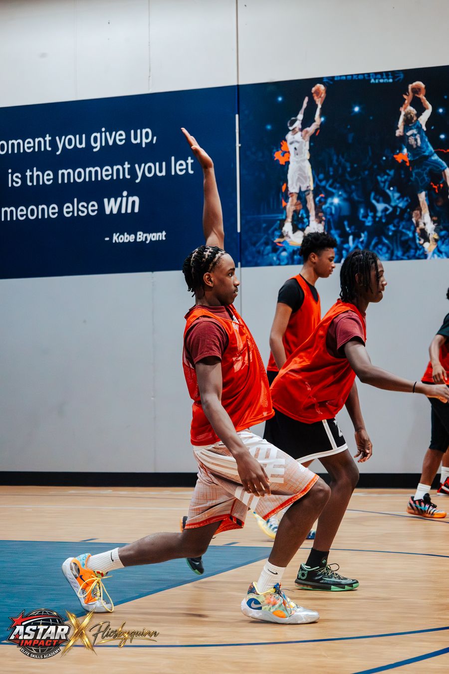 An athlete driving to the basket