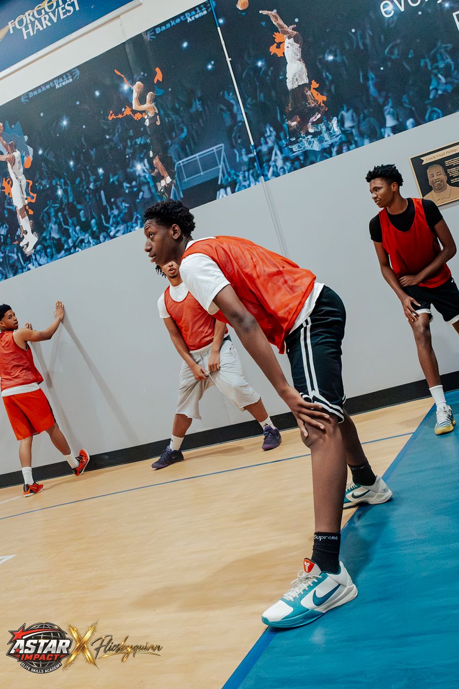 An athlete in a defensive stance during a drill